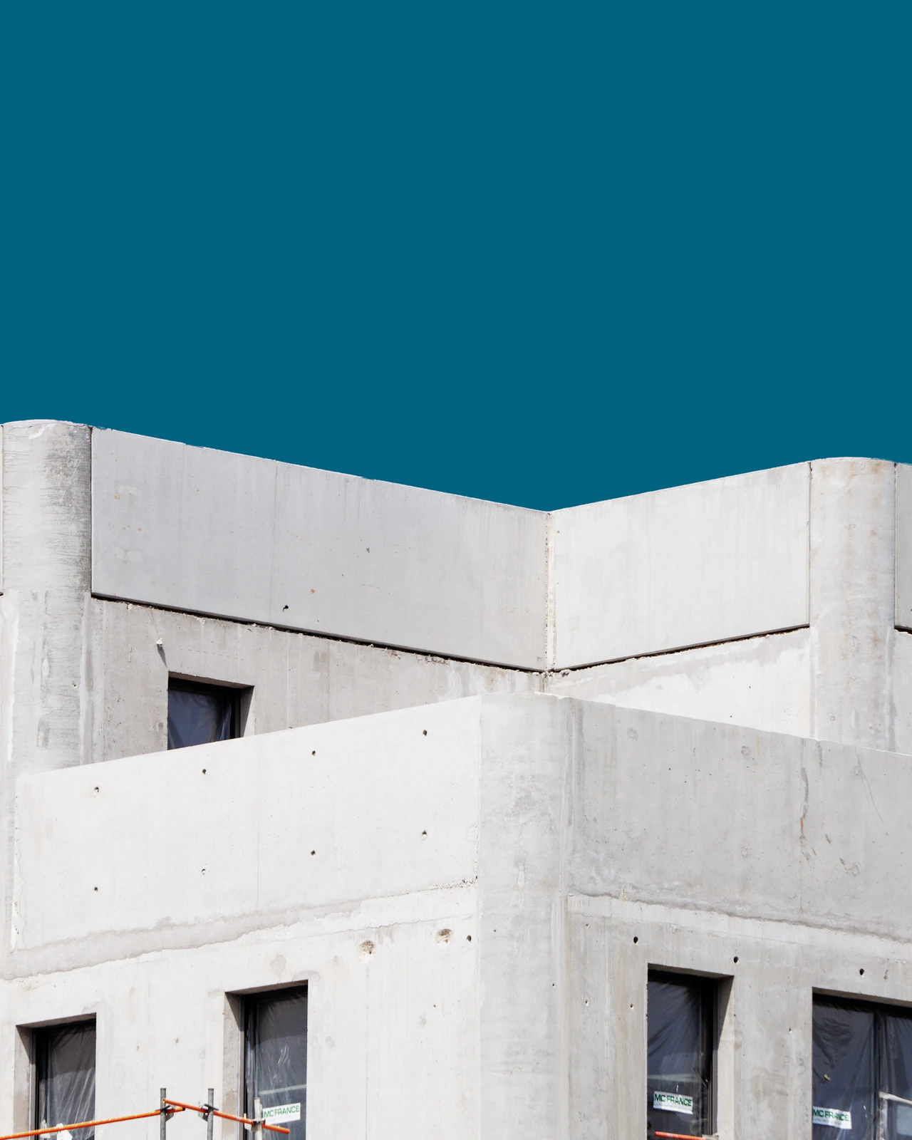 Concrete architectural forms framing open sky