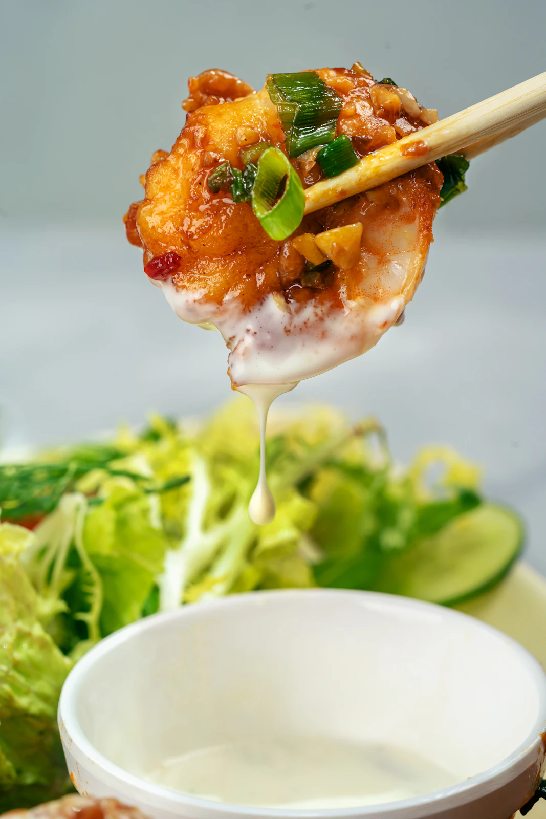 A carefully plated seafood dish with herbs and sauce